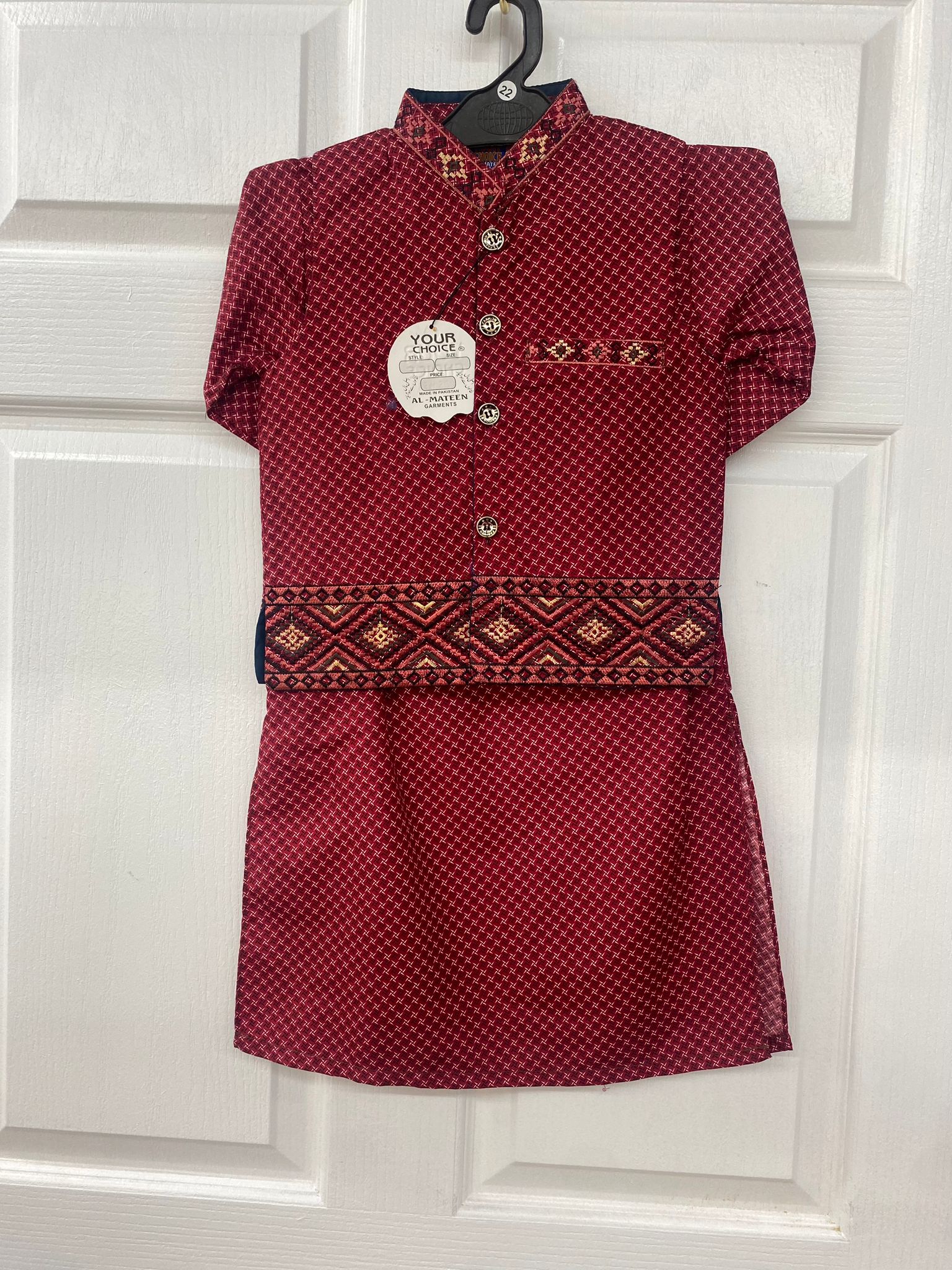 Red color salwaar kameez with waist coat.